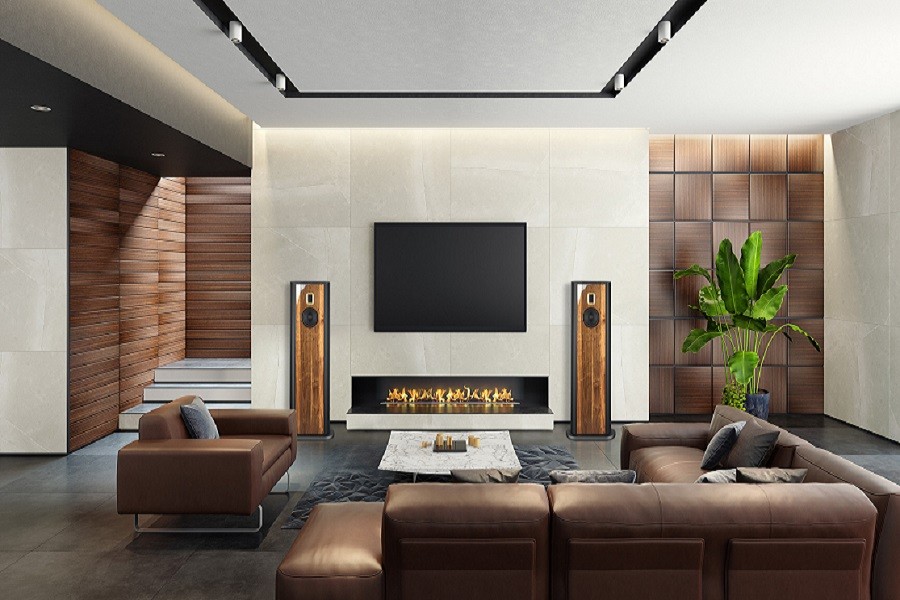 Luxury living room with modernist couches, minimalist fireplace, and Steinway Lyndorf speakers delivering high-end audio. 
