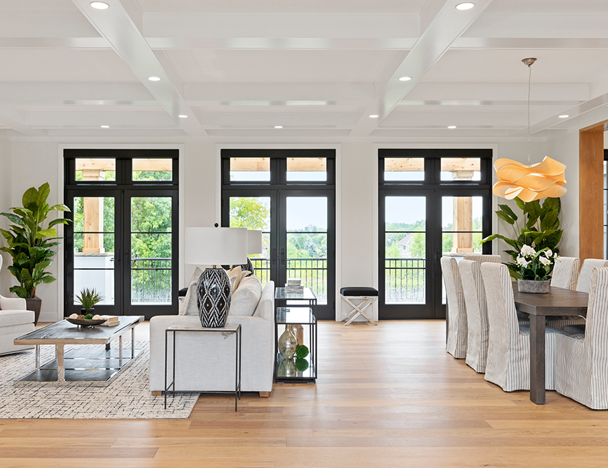 A well-lit living room and kitchen area.