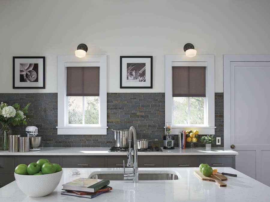 A modern kitchen in a Boulder home with Lutron motorized shading. 