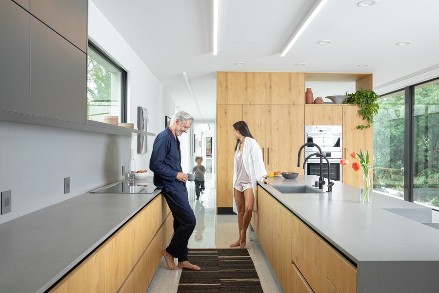 A couple is talking in a modern kitchen in Boulder.