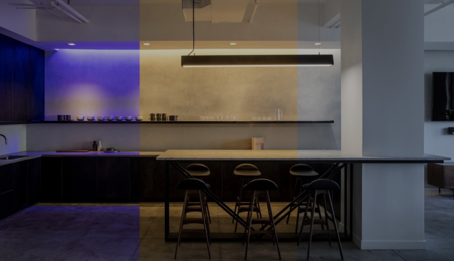 A modern kitchen pictured in both warm white and mauve light, showcasing tunable lighting automation in a Colorado Springs home. 