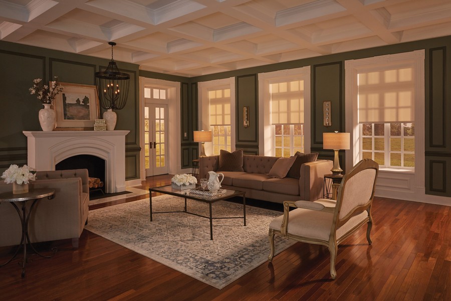  A luxurious living room in Denver with motorized shades filtering late afternoon sunlight. 