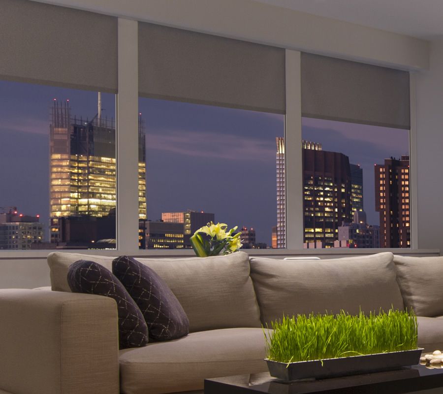 crestron roller shades with city view out window